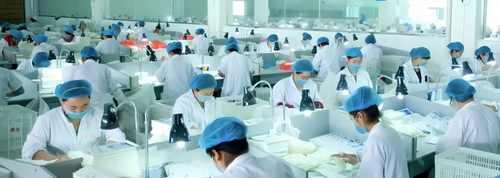 Workers in a sterile manufacturing environment