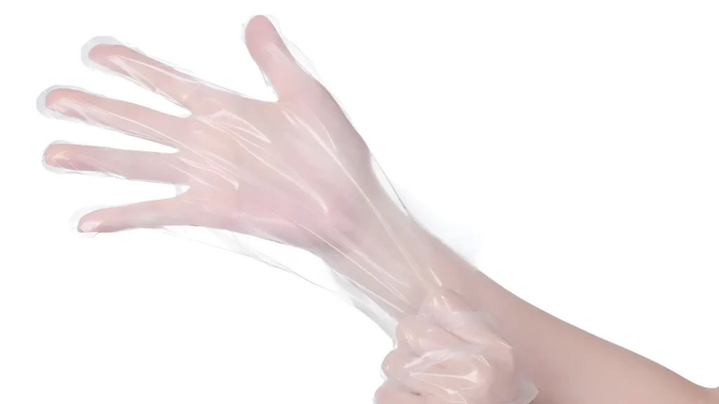Hand wearing a transparent plastic glove